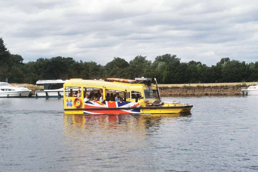 Yellow duck bus in a river