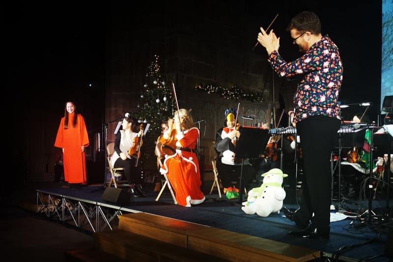 Orchestra and conductor with female soloist