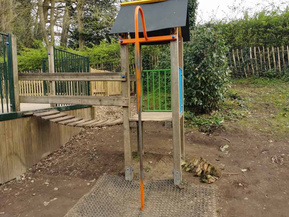 Wooden bridge and child size firemans pole