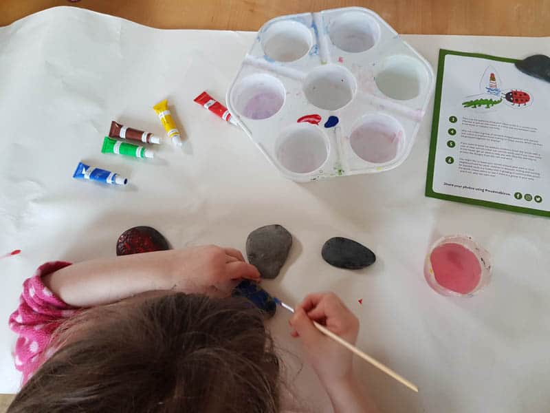 Child painting rocks
