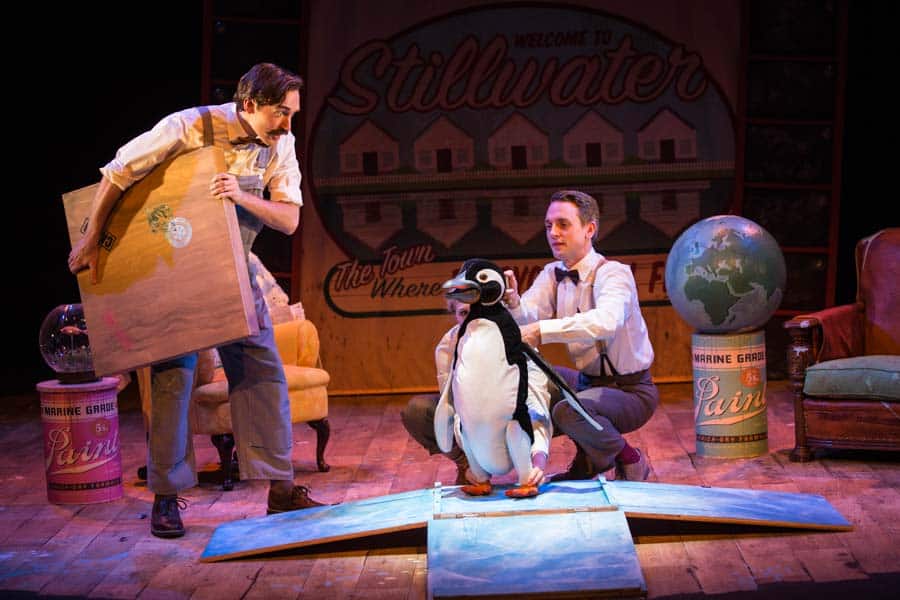 Actors and penguin puppets on set
