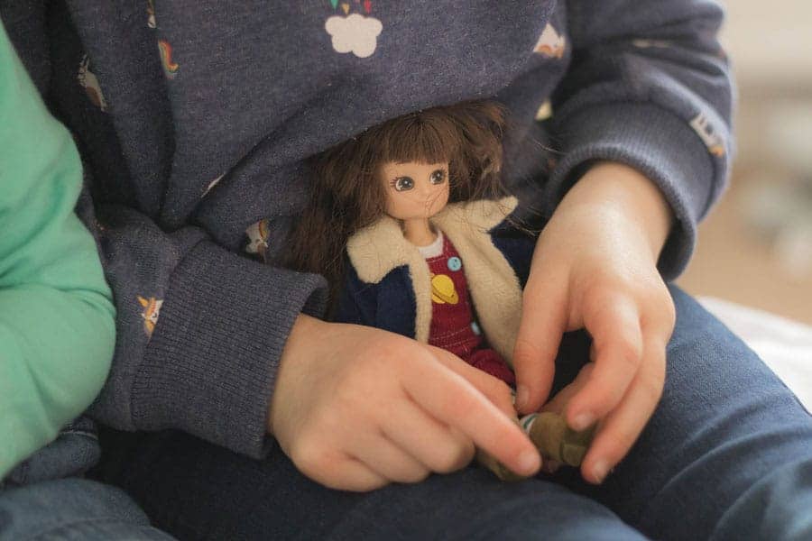 Girl with a Lottie doll