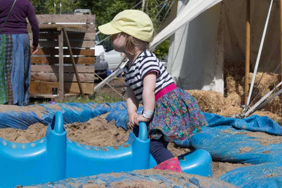 Child in sand pit