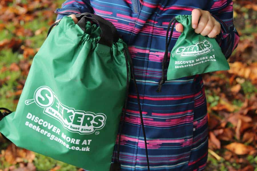 Green drawstring bag with logo Seekers on them