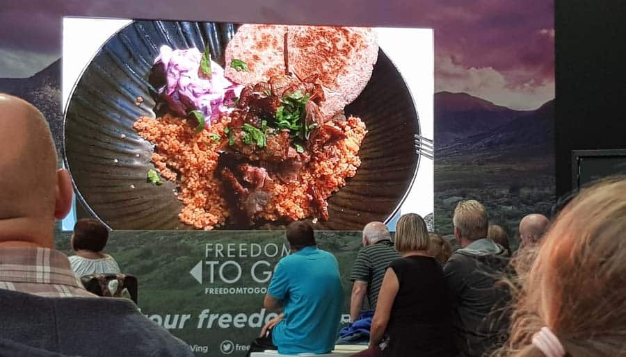 Large photo of a cous cous dish on a big screen