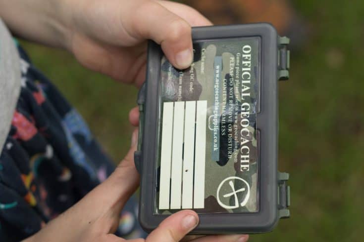 Child holding a geocache box