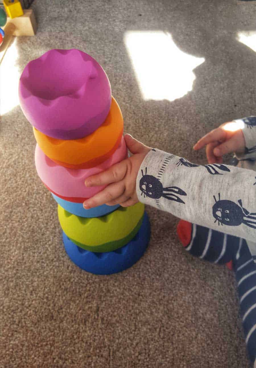 Stacking toy and childs hand