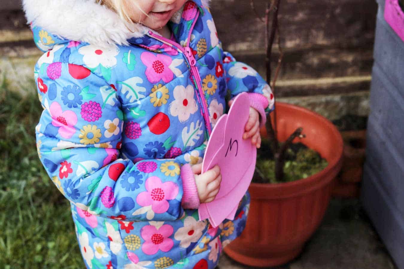 Child holding foam hearts
