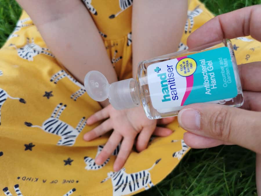 Childs hand waiting for hand sanitiser