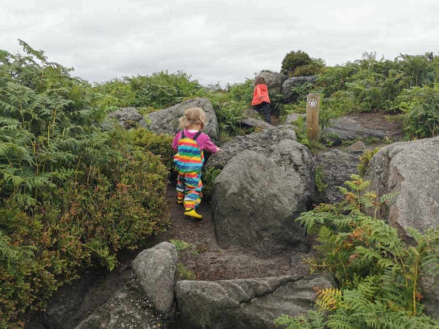 Children climbing rocky path