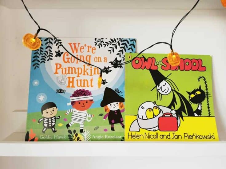 Book ledge with two cute Halloween books on and a string of pumpkin fairy lights