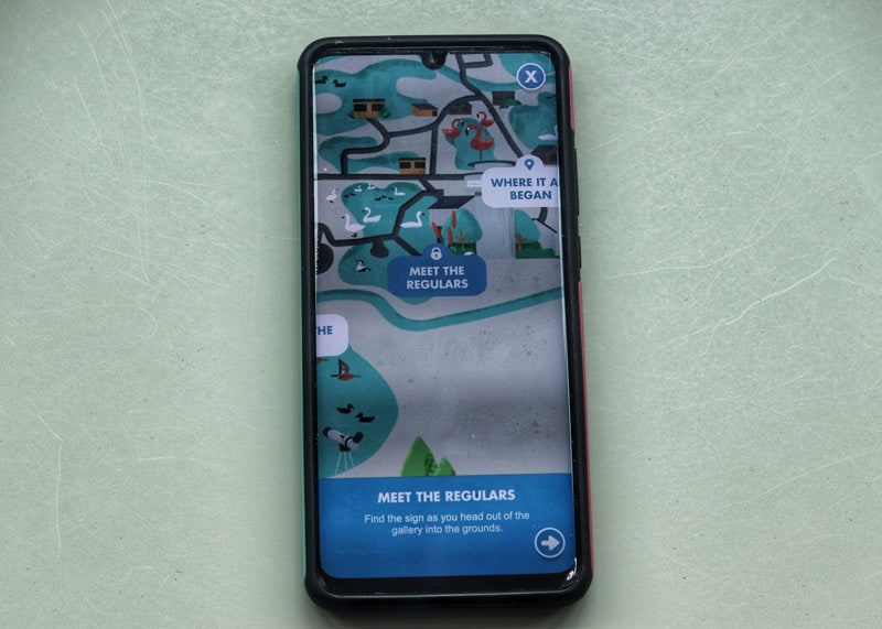 Phone with wetland heroes app map