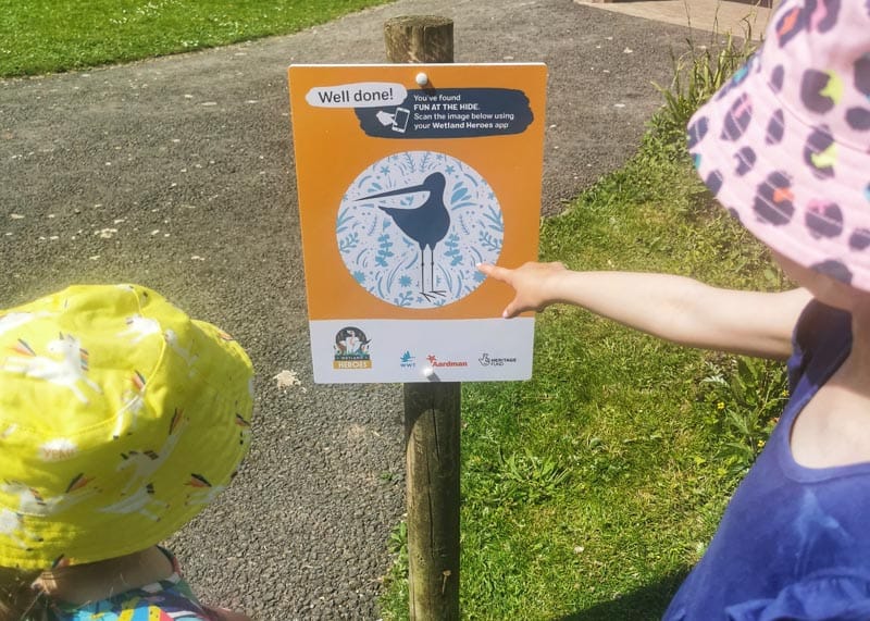 Children pointing at a sign in Slimbridge wetlands