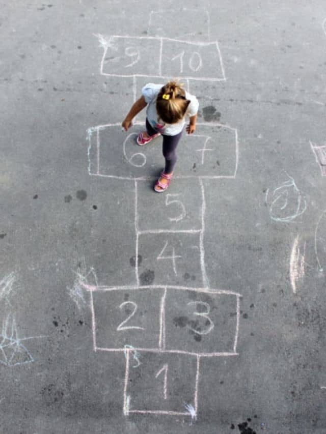 child playing hopscotch