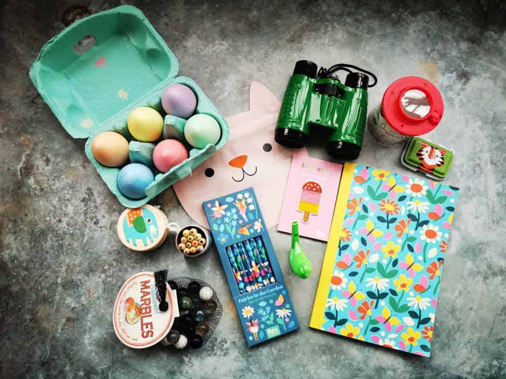 Collection of toys for kids arranged on a stone background