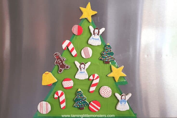 Green paper Christmas tree with salt dough decorations on it