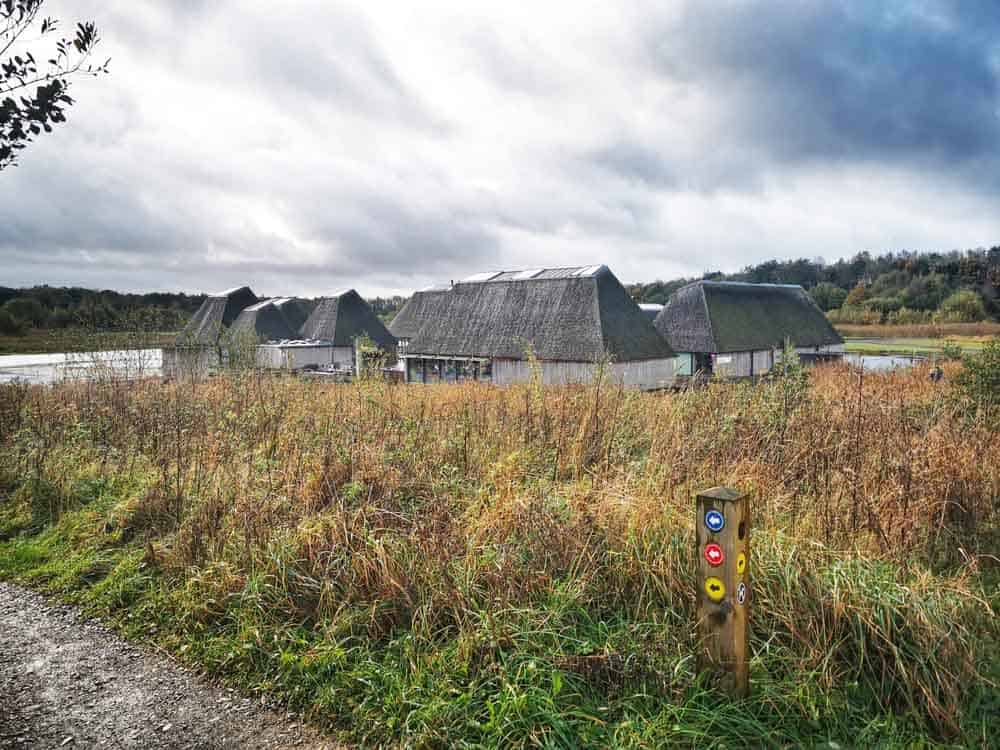 Floating visitors centre at Brockholes Preston behing a wild expanse of grass
