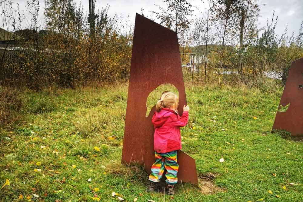 Child a metal sign with cut out swan shape