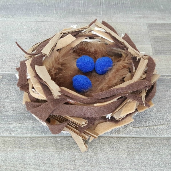 nest crafted using cardboard and brown felt