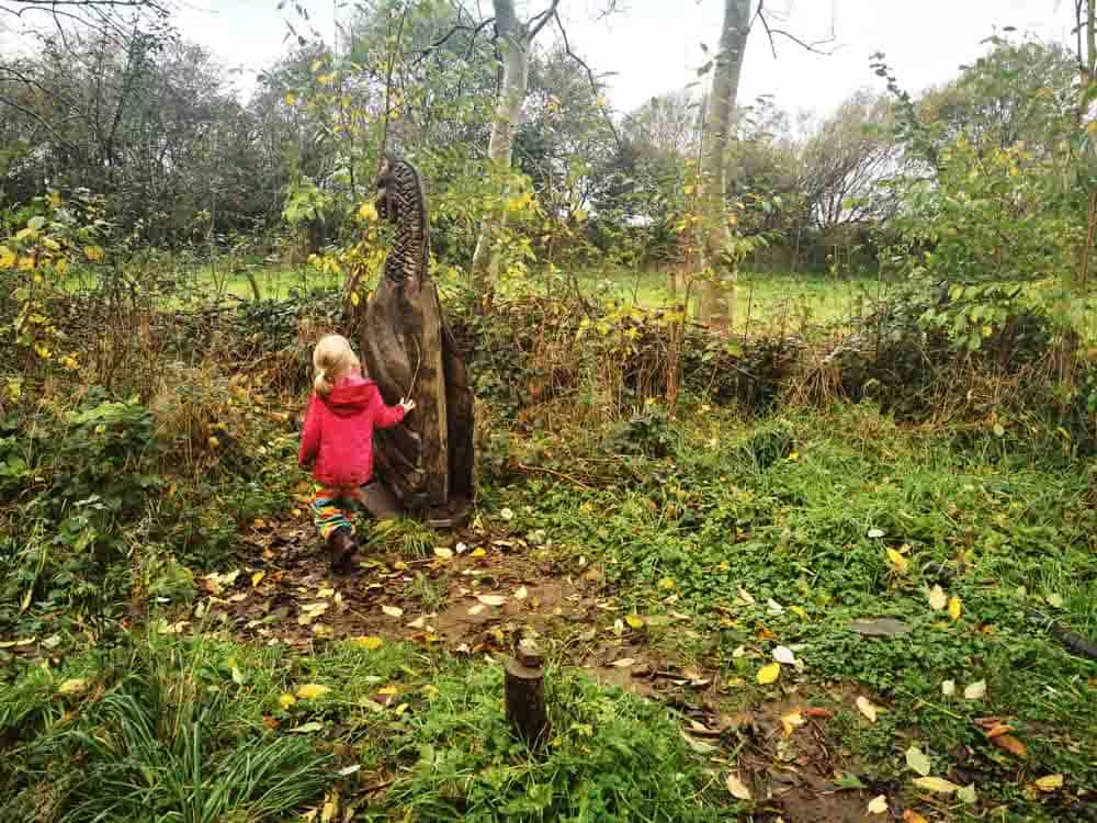 Child and viking boat sculpture