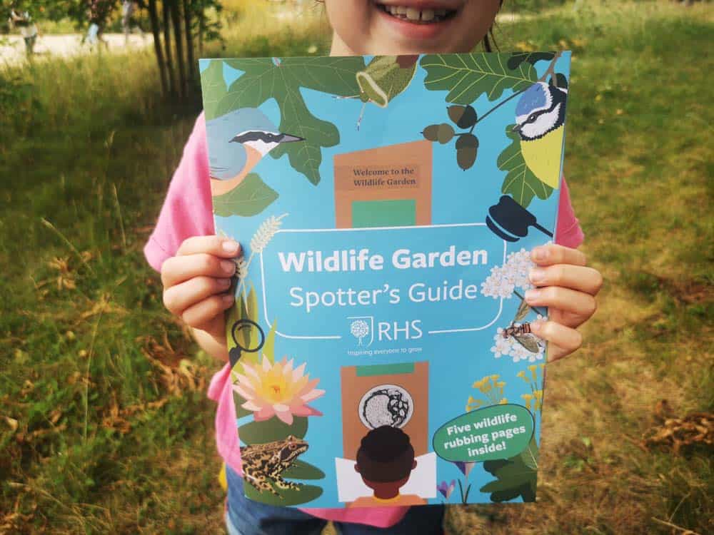 Child holding a wildlife booklet