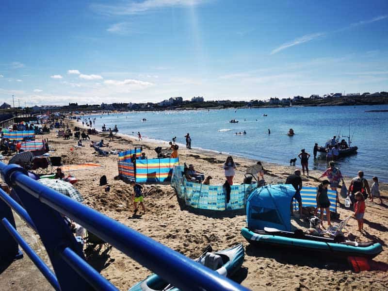 Busy beach on sunny day