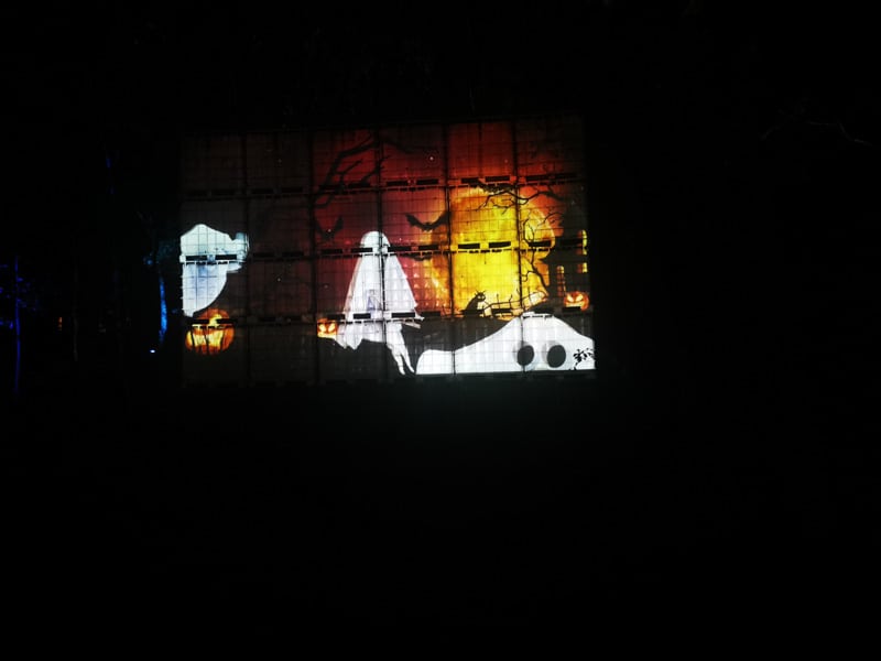 Screen with Halloween movie projected on it