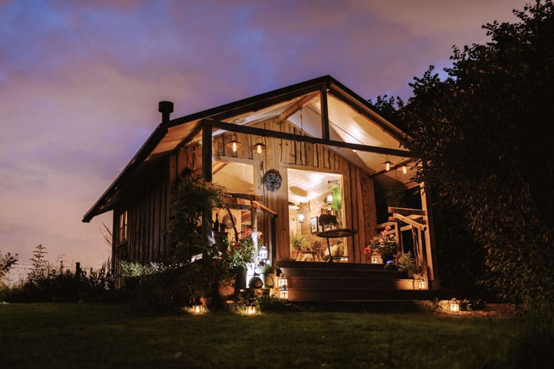 Nordic cabin in the dark, all lit up
