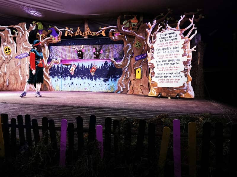 Festive stage with an elf and two reindeer puppets