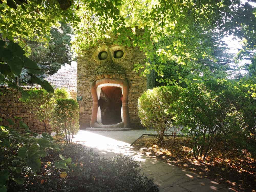 Tunnel in a wall that looks like you are walking in to a mouth