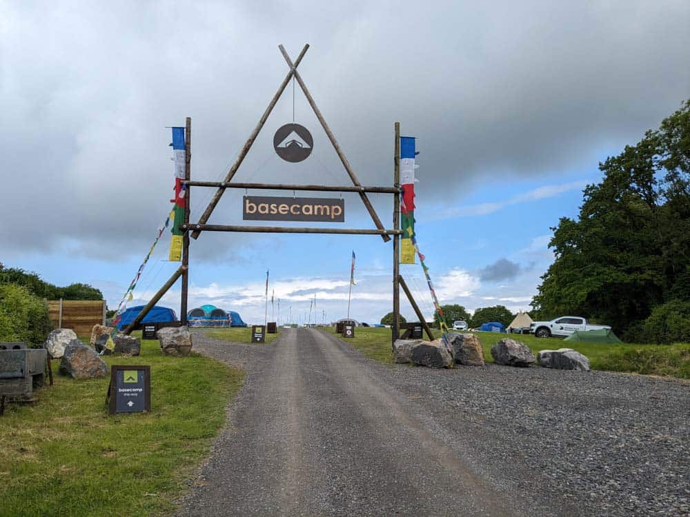 Wooden sign and flags for Mendip basecamp