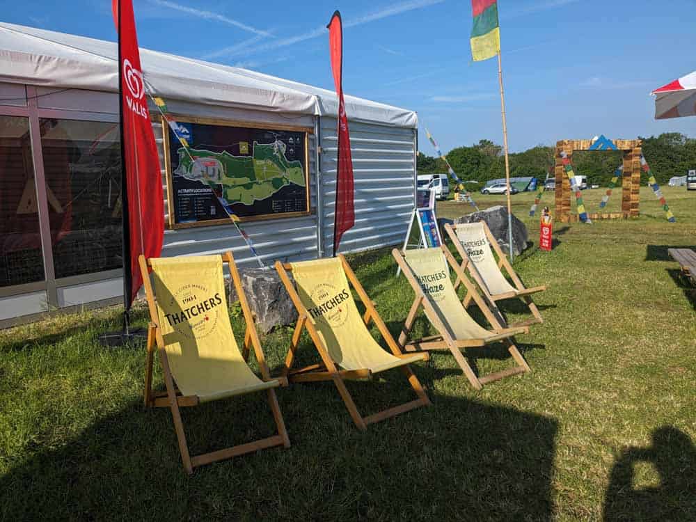 Deck chairs outside a pavillion marquee
