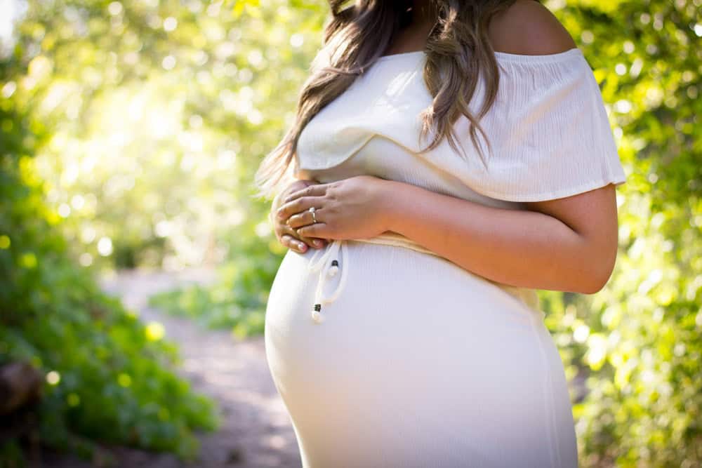 Pregnant lady in white dress