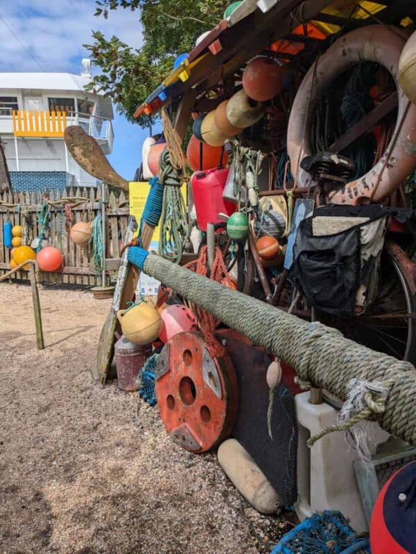 lots of coloured plastic hanging from a fence