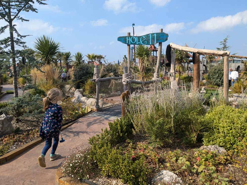 Child playing viking themed crazy golf