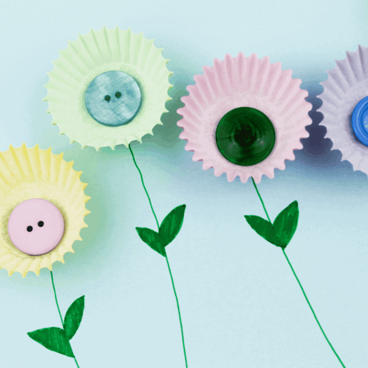 Muffin case and buttons on paper to look like flowers