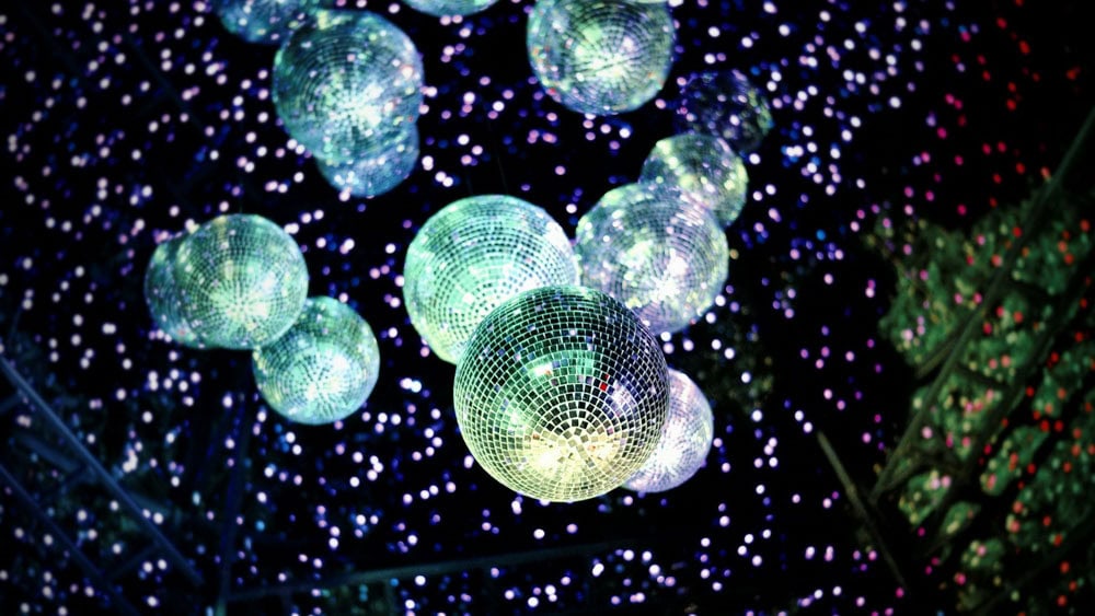Lots of disco balls on black background