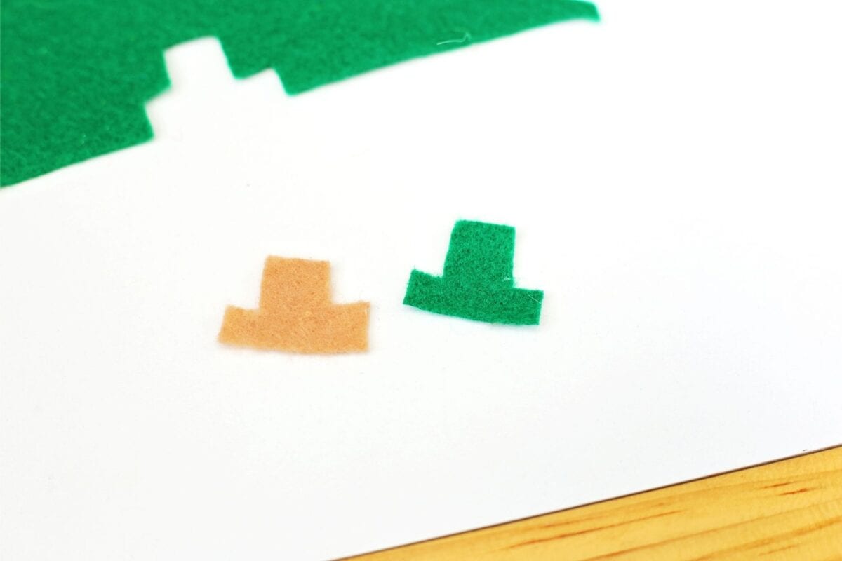 Green felt sheet and two small hat shapes in green and brown felt