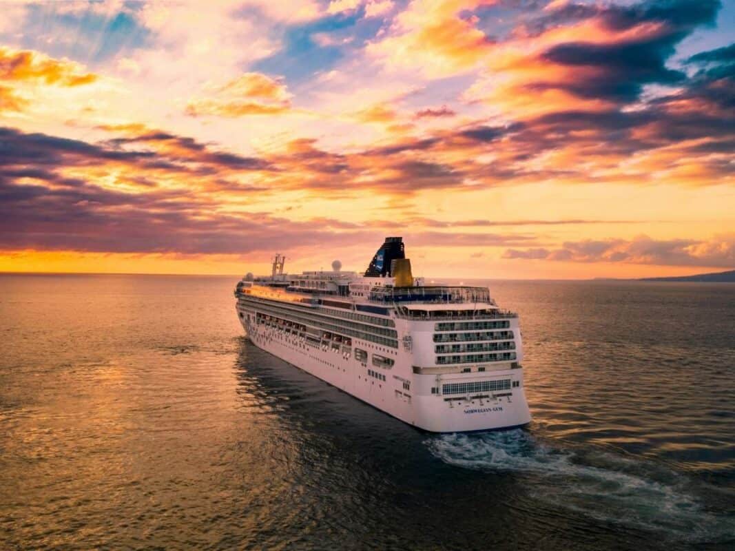 Large cruise ship at sea at sunset